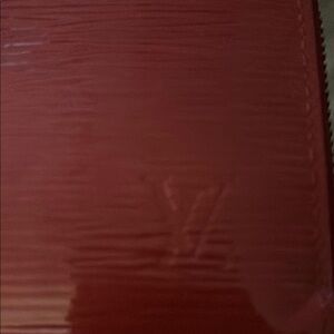 Louis Vuitton Red Epi long zip wallet.
